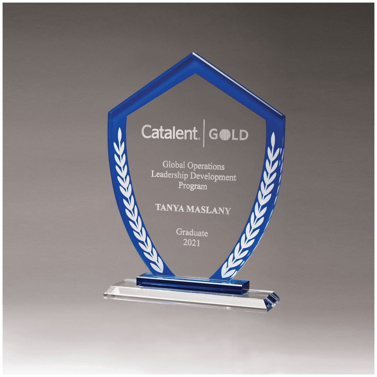 Shield Shaped Glass Award with Blue Border and White Laurel Leaves